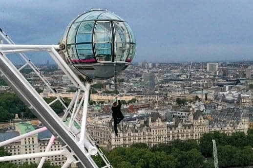 Arco Professional Safety Services working at height expert Steve Dawson scales the London Eye dressed as a secret agent to promote a film premiere